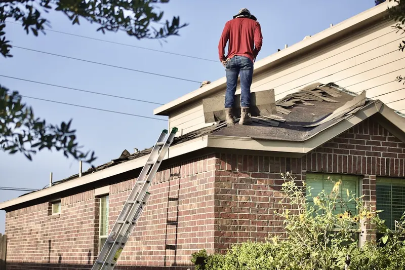 Professional roofer working on a residential roof in Oldtown